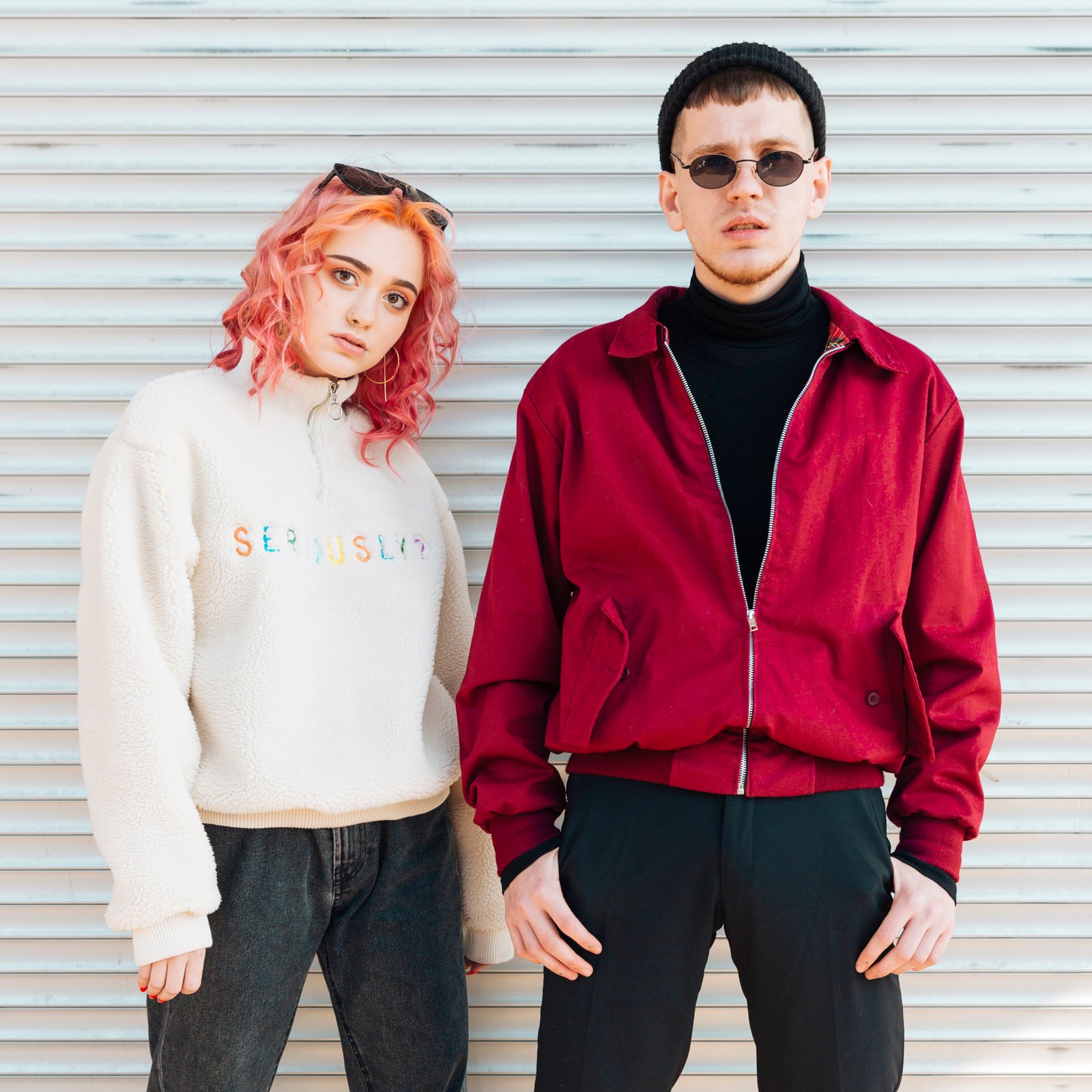 attentive-young-man-woman-standing-street